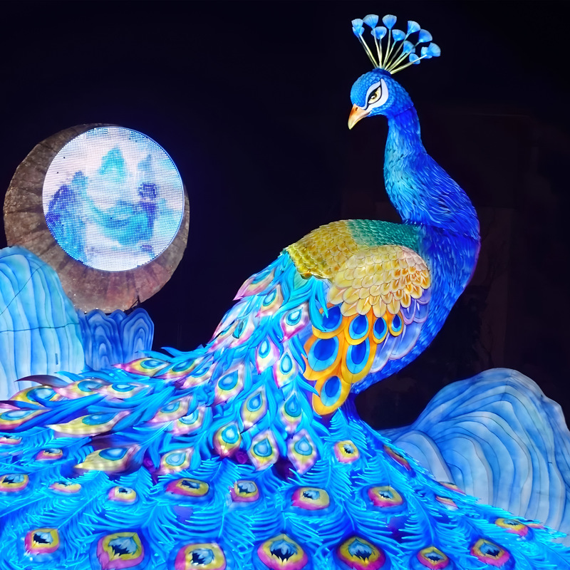 Custom Giant Peacock Zigong Lantern, Large Peacock Spreading Tail Silk Light Sculpture with Mountain & Moon Backdrop, Waterproof Outdoor Festival Light Exhibition