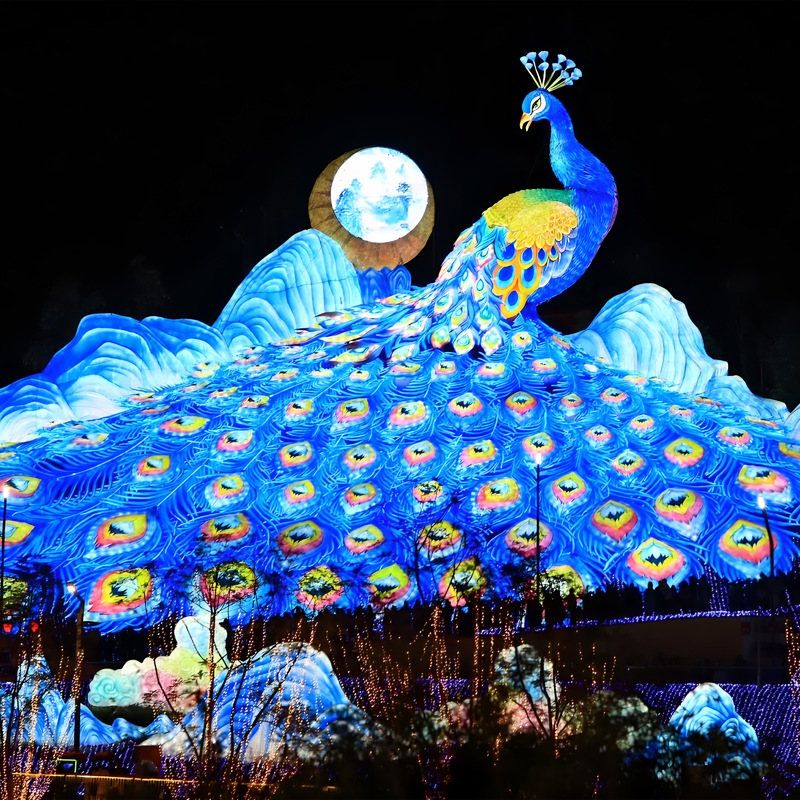Custom Giant Peacock Zigong Lantern, Large Peacock Spreading Tail Silk Light Sculpture with Mountain & Moon Backdrop, Waterproof Outdoor Festival Light Exhibition